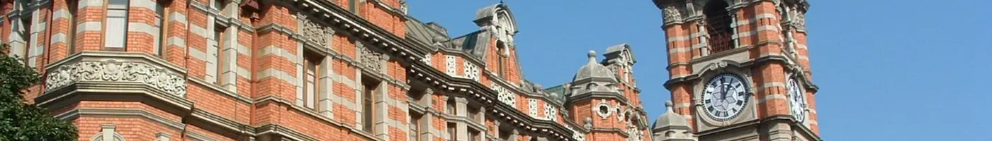 The red brick and stone bands of Pietermaritzburg City Hall, with its clock tower